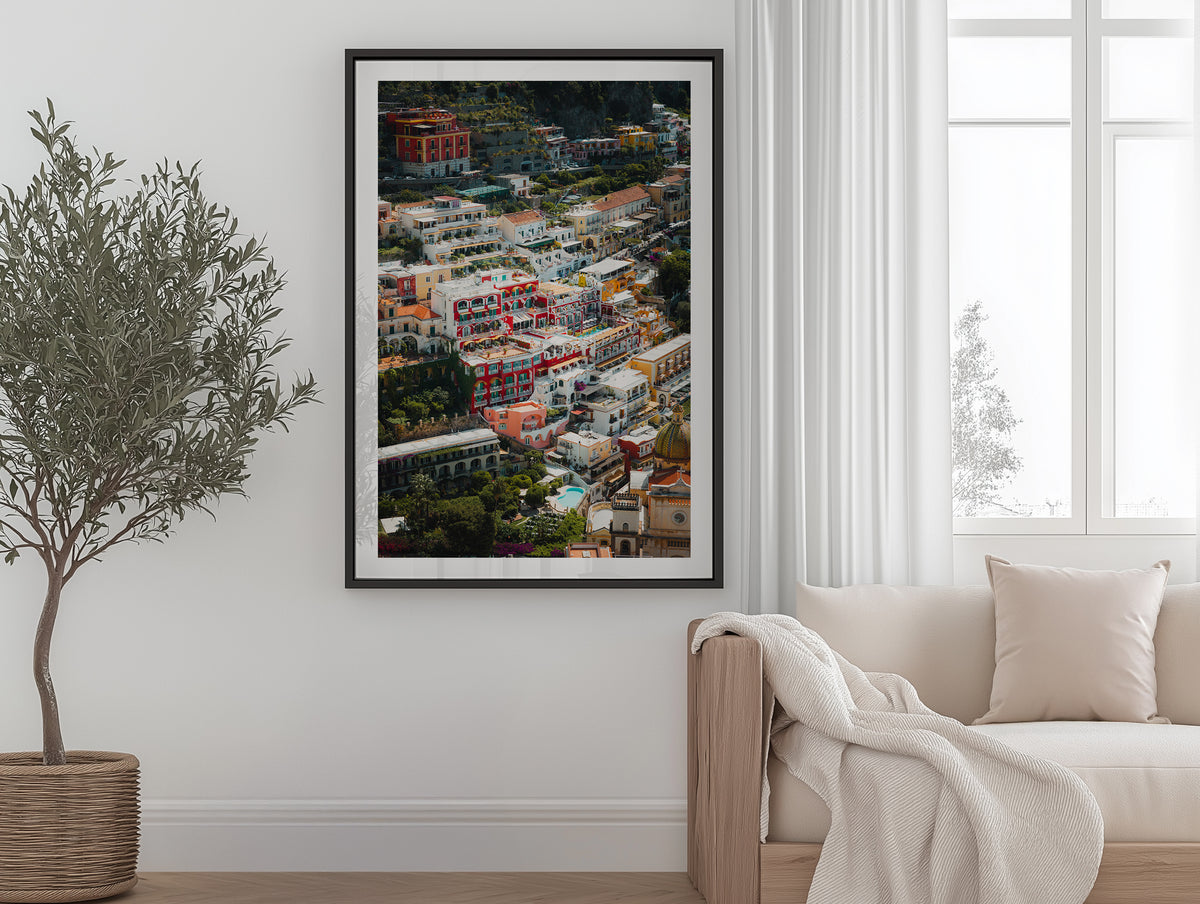 Colour aerial view of Positano residences framed artwork displayed in an interior
