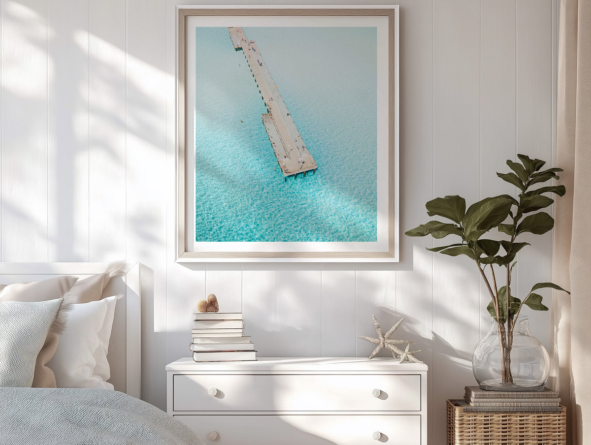 Rosebud Pier in Aerial framed artwork displayed on a room wall