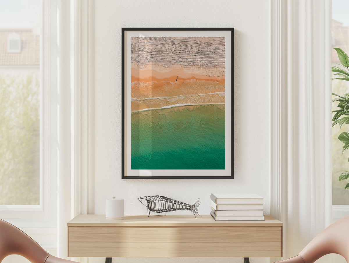 Orange and turquoise aerial shoreline in South Australia framed artwork displayed on a room wall