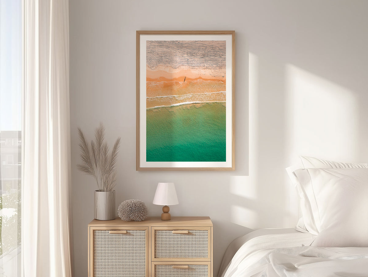 Orange and turquoise aerial shoreline in South Australia framed artwork displayed in an interior